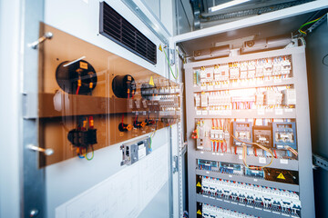 Open electric cabinet at modern power station