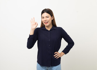 Portrait of Young beautiful mixed race woman standing and smiling isolated on white background showing ok sign. Attractive female feeling surprised and happy.