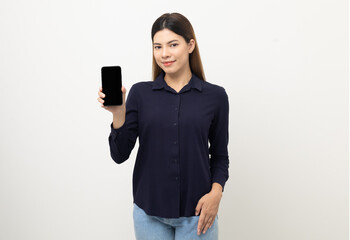 Pretty young mixed race woman using smartphone standing on isolated white background. She texting on cell phone. Feeling happy and excited