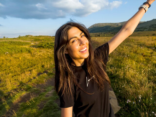 Happy Smiling Woman in the Mountain on sunset light   . Vitosha Mountain ,Bulgaria