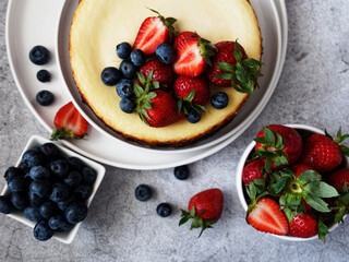 strawberry and blueberry on a cheesecake