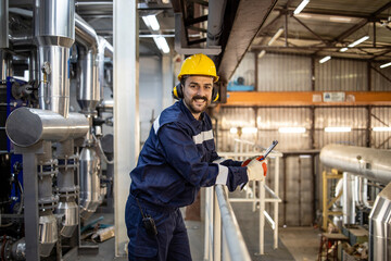 Portrait of factory manager smiling to the camera.