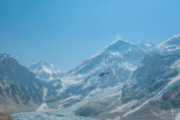Everest base camp Gorakshep rescue helicopter in action Himalayas Nepal, small settlement that sits...