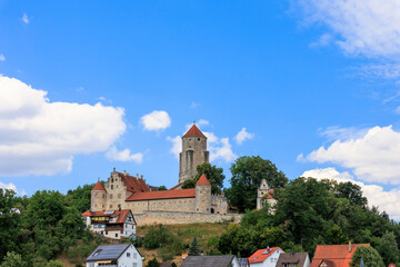 Fototapeta premium Medieval spur castle Niederalfingen in district Niederalfingen of the municipality Hüttlingen in Ostalbkreis in Baden-Württemberg on a mountain with blue sky