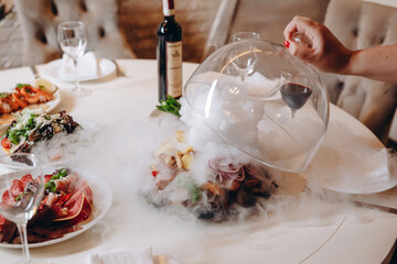 There is a table in the restaurant for four clients.