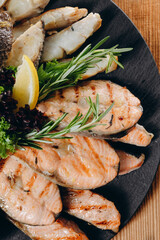 There is a interesting dish with sauce and cream in front of the person in the restaurant