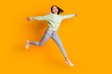 Fototapeta na wymiar Full body photo of young pretty woman have fun jump up spring travel isolated over yellow color background