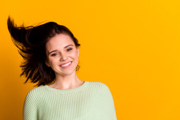 Portrait of young attractive cheerful girl perfect clean smooth hair flying anti dander dandruff isolated on yellow color background