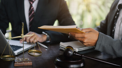 Business people and lawyers discussing contract papers sitting in the table at office in the morning. concepts of law, advice, legal services.