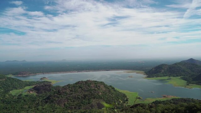 Aerial view of Aliyar dam in Tamil Nadu. A wide shot of the dam is located in the foothills of Valparai, in the Anaimalai Hills of the Western Ghats.