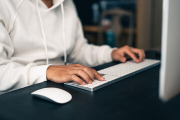 Man working on computer desk at home office