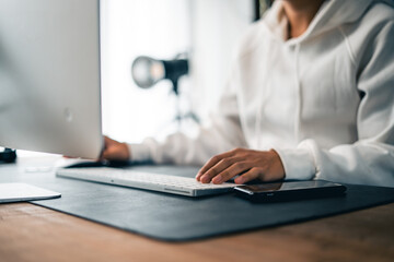 Man working on computer desk at home office