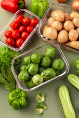 Glass boxes with fresh raw vegetables.  Vegetables and fruits in glass containers. Food storage concept