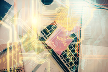 Double exposure of map hologram drawing over study table background with computer. Concept of international network. Top view.
