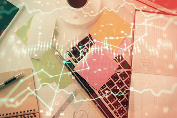 Multi exposure of financial chart drawing over table background with computer. Concept of research and analysis. Top view.