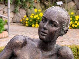 Fototapeta na wymiar close-up of bronze sculpture of the nymph at the Trauttmansdorff gardens of Merano - South Tyrol, northern Italy