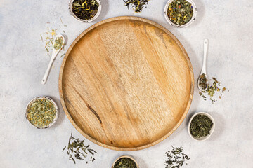 A wooden tray and Various types of tea. View from above. Copy space