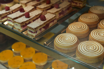 Showcase with sweet cakes. Confectionery