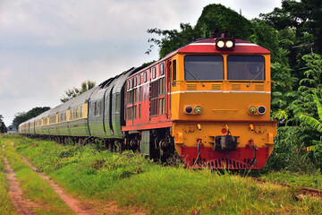 Fototapeta na wymiar Passenger train by diesel locomotive on the railway