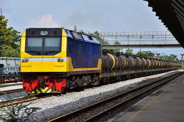 Fototapeta premium Tanker-freight train by diesel locomotive on the railway.