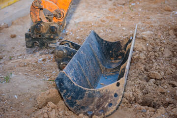 Repair of the excavator bucket, replacement of the nozzle on the boom.