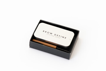 Bamboo brow brush and brow styling soap in a metal box. Cosmetic set