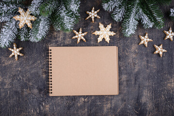 Fototapeta na wymiar Christmas composition with empty craft notebook