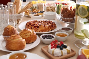 Variety of snacks on wooden table in buffet style