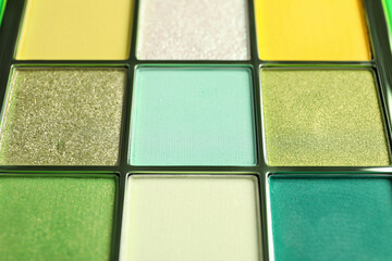 Beautiful palette of colorful eyeshadows as background, closeup