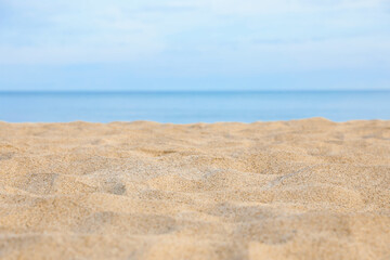 Fototapeta na wymiar Closeup view of sandy beach near sea