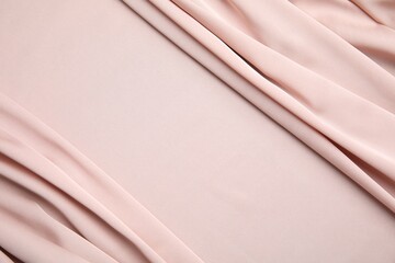 Obraz premium Texture of delicate pink silk as background, top view