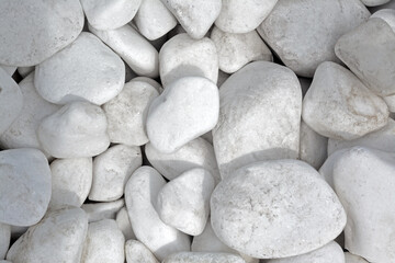 Pile of white stones as background, top view