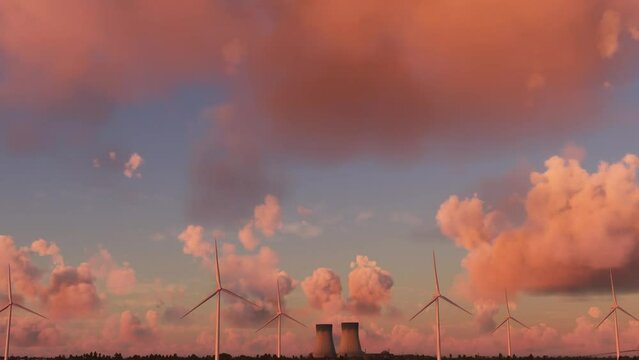 Aerial flight at sunset of some windmills and a nuclear power plant in Doel. Belgium