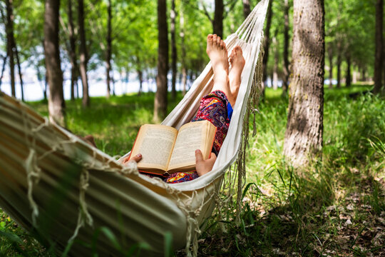 Women reading in forest