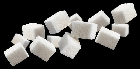 Flying cubes of white sugar, isolated on black background