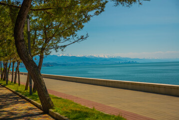 KOBULETI, GEORGIA: Landscape with a view of the promenade by the beach on the Black Sea on a sunny summer day.