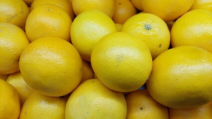 yellow fruits background of oranges