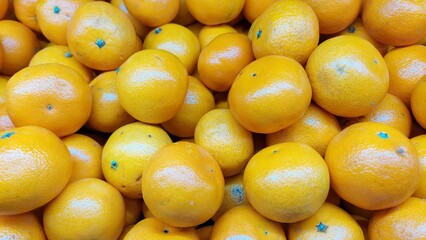 yellow fruits background of oranges