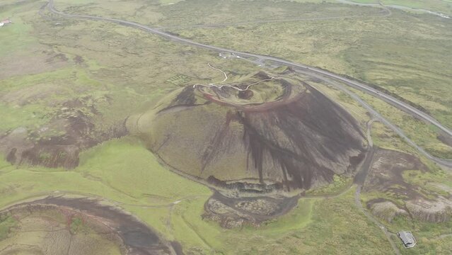 Revolving Grabrok Volcano Crater Near Bifrost Town In Western Iceland. Aerial Drone Shot
