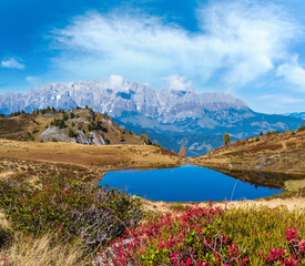 Naklejka premium Autumn alpine Kleiner Paarsee or Paarseen lake, Land Salzburg, Austria. Alps Hochkonig rocky mountain group view in far.
