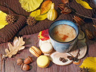 autumn still life with cup of coffee and macaroons