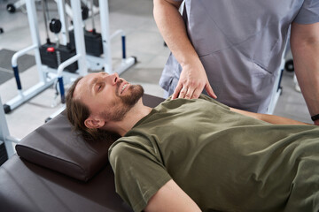 Military man on a massage table in a rehabilitation center