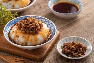 Taiwanese savory rice pudding Wa gui with chopped dried radish and soy sauce