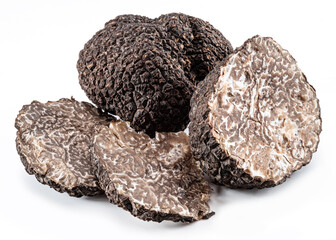 Black winter truffle and truffle slices on white background. The most famous of the trufflez.