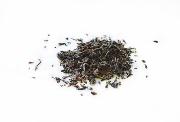 An isolated beverage of dry tea leaves with the selective focus. Good for any project.
