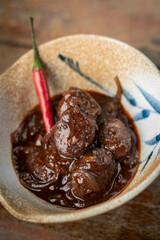spicy chorizo sausage in red wine escabeche sauce tapas