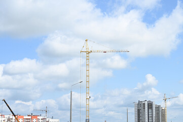 Fototapeta premium Construction site with many tower cranes. Construction an new apartment building.