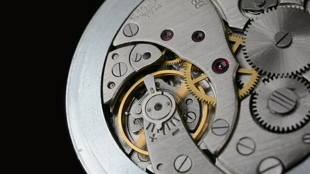 Clockwork. Macro shot of clock mechanism. Gears. Artistic blur
