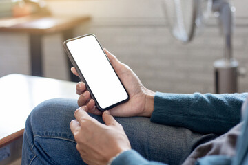 cell phone blank white screen mockup.hand holding texting using mobile on desk at office.background empty space for advertise.work people contact marketing business,technology