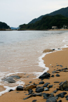 beach and sea with wave rocks